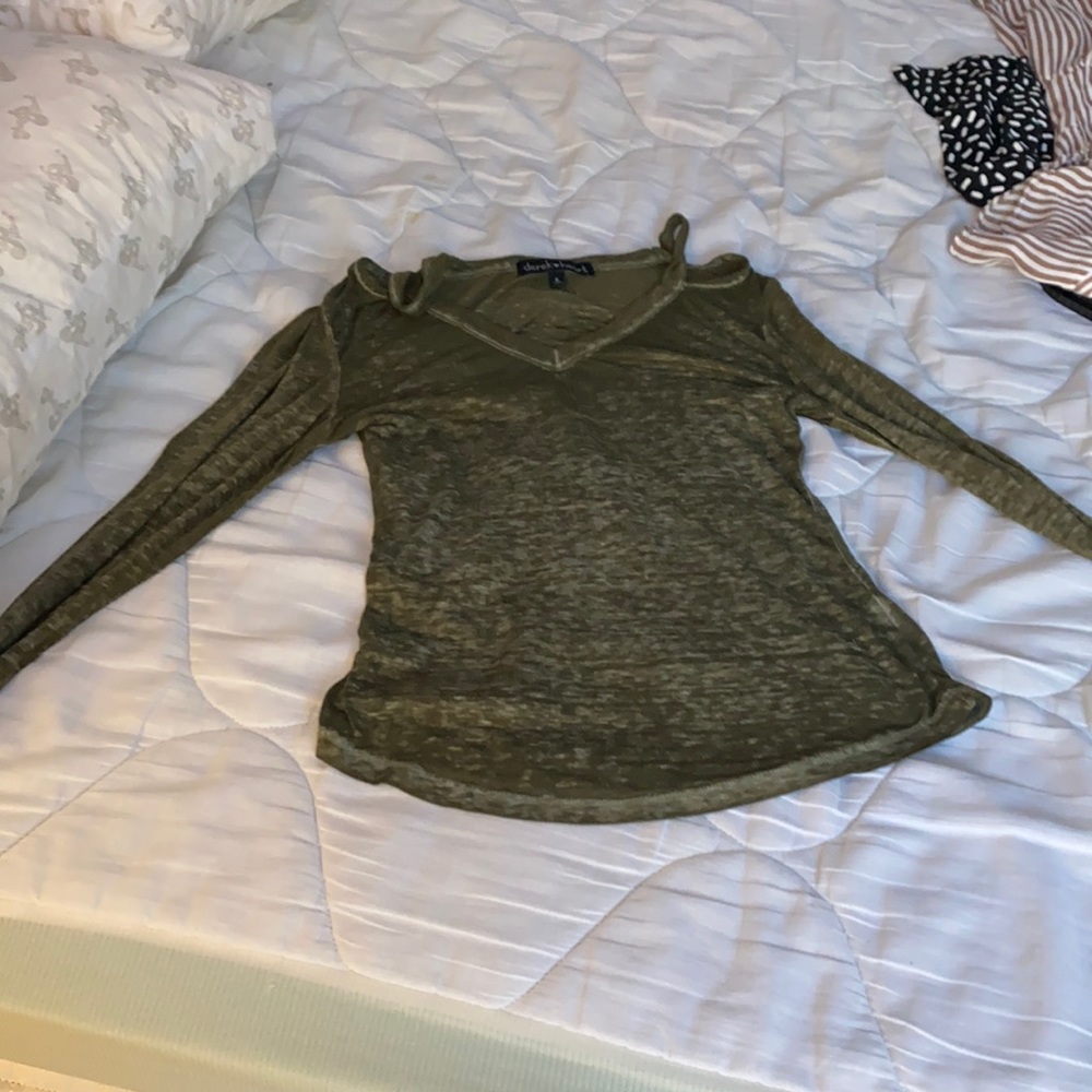 A green off the shoulder long sleeves shirt